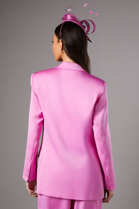 Luxurious satin finish that catches the light beautifully for special occasions
        Elegant double-breasted design with sophisticated button detailing
        Structured notch lapel adds a refined tailoring element
        Practical side pockets perfect for essentials
        Flattering silhouette with subtle stretch for comfortable all-day wear
    
    Make a striking impression at your next formal event with this stunning satin blazer from Coast. The double-breasted design creates a commanding silhouette that embodies confidence and sophistication. Style as seen with coordinating wide-leg trousers and a statement fascinator for race day glamour, or pair with a sleek pencil skirt for wedding guest perfection. The lustrous fabric reflects light beautifully, ensuring you stand out for all the right reasons. For evening affairs, try wearing over a delicate camisole with tailored trousers and pointed court shoes. The versatile design transitions seamlessly from daytime occasions to evening soires, making it a wardrobe investment that delivers time and again. The subtle stretch in the fabric ensures comfort without compromising on structure, allowing you to maintain poise throughout your special event.