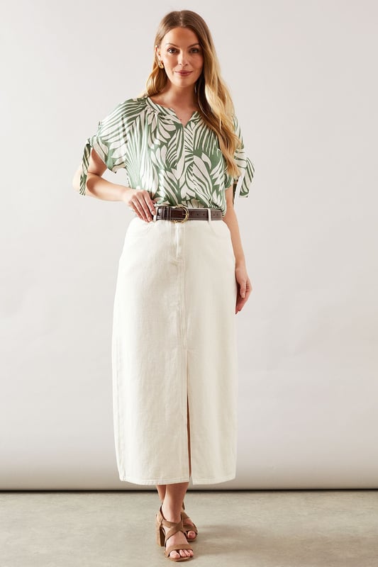 Distinctive collarless design with elegant V-neckline for a sophisticated silhouette
        Unique tie sleeve detail adding a touch of feminine charm to this woven top
        Relaxed fit through the body for all-day comfort and effortless movement
        Versatile abstract print that makes a statement whilst remaining wonderfully wearable
        Short sleeves with decorative ties that create a graceful drape effect
    
    This captivating collarless top from Wallis combines comfort with sophisticated style. The eye-catching abstract print creates visual interest whilst the tie sleeve detail adds a touch of feminine flair to your daywear collection. Style with a belted cream midi skirt and leather sandals for a refined lunch date look, or pair with tailored trousers and ballet flats for family gatherings. The V-neckline frames the dcolletage beautifully, making it perfect for showcasing delicate jewellery. The viscose-blend fabric offers a lovely drape that flatters the figure without clinging. This versatile piece transitions seamlessly from casual coffee mornings to afternoon garden parties, making it an essential addition to your wardrobe that works across multiple seasons.