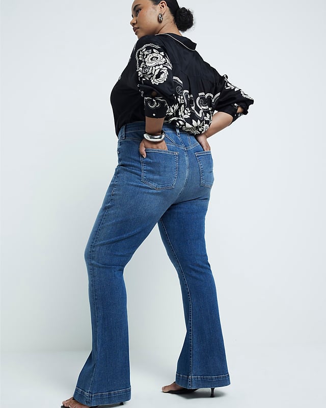Plus collection, Mid rise, Flare design, Denim fabric, Belt loops, Classic 5 pockets, Button and zip fastening, Cotton for this product has been more responsibly sourced