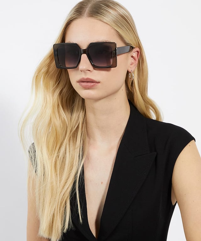 Take your edit to the next level with our Glitzy sunglasses. This trend-led frame features a gradient lens and a thick frame that is adorned with a diamante inlay across the top and side. So, whether you're strolling along the beach or navigating the city streets, Glitzy is certain to add a touch of glamour to your warm-weather ensembles.