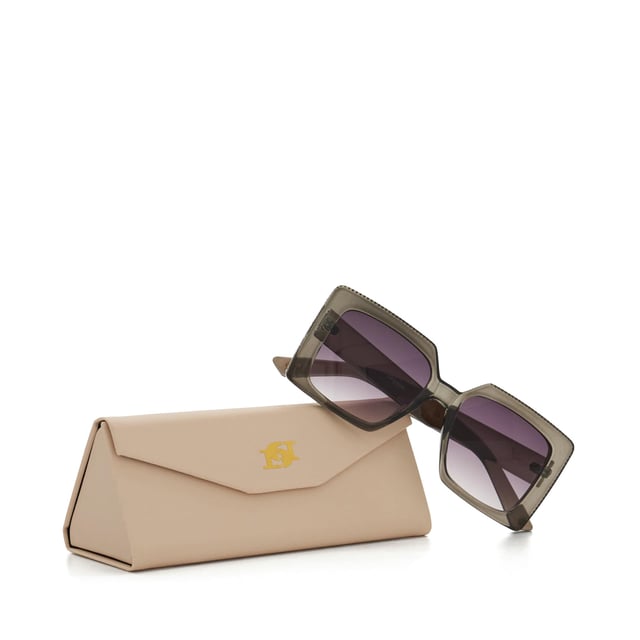 Take your edit to the next level with our Glitzy sunglasses. This trend-led frame features a gradient lens and a thick frame that is adorned with a diamante inlay across the top and side. So, whether you're strolling along the beach or navigating the city streets, Glitzy is certain to add a touch of glamour to your warm-weather ensembles.