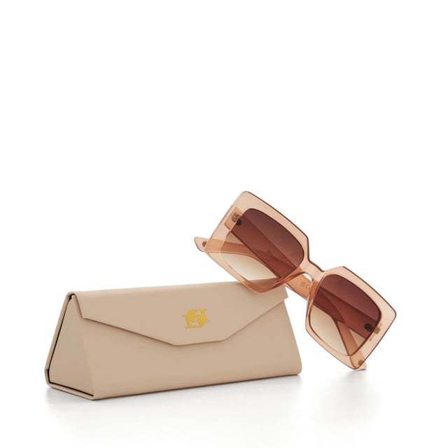 Take your edit to the next level with our Glitzy sunglasses. This trend-led frame features a gradient lens and a thick frame that is adorned with a diamante inlay across the top and side. So, whether you're strolling along the beach or navigating the city streets, Glitzy is certain to add a touch of glamour to your warm-weather ensembles.