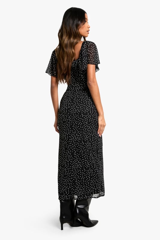 Chiffon midi dress with allover polka dot pattern
        Flattering sweetheart neckline for a feminine touch
        Short flutter sleeves add movement and charm
        Figure-hugging silhouette accentuates curves
        Versatile length suitable for various occasions
    
    Make a statement at your next formal event with this enchanting polka dot midi dress from Boohoo. The chiffon fabric drapes beautifully, creating a graceful silhouette that's perfect for weddings, races, or graduations. The sweetheart neckline and flutter sleeves add a romantic flair, while the fitted bodice and flowing skirt balance sophistication with allure. Style it with strappy heels and a clutch for an elegant ensemble, or dress it down with ankle boots and a leather jacket for a chic day-to-night look. This versatile piece can be accessorised to suit any occasion, making it a must-have addition to your wardrobe. Whether you're attending a garden party or a cocktail soire, this dress will ensure you're always dressed to impress.