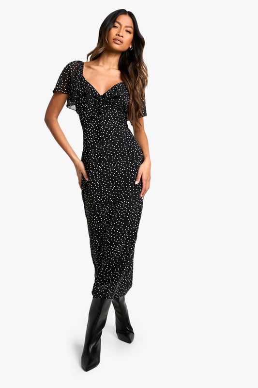 Chiffon midi dress with allover polka dot pattern
        Flattering sweetheart neckline for a feminine touch
        Short flutter sleeves add movement and charm
        Figure-hugging silhouette accentuates curves
        Versatile length suitable for various occasions
    
    Make a statement at your next formal event with this enchanting polka dot midi dress from Boohoo. The chiffon fabric drapes beautifully, creating a graceful silhouette that's perfect for weddings, races, or graduations. The sweetheart neckline and flutter sleeves add a romantic flair, while the fitted bodice and flowing skirt balance sophistication with allure. Style it with strappy heels and a clutch for an elegant ensemble, or dress it down with ankle boots and a leather jacket for a chic day-to-night look. This versatile piece can be accessorised to suit any occasion, making it a must-have addition to your wardrobe. Whether you're attending a garden party or a cocktail soire, this dress will ensure you're always dressed to impress.