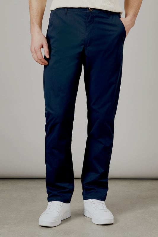 Half elasticated waistband for comfortable all-day wear
        Slim fit design offers a modern, streamlined silhouette
        Practical back pockets with button closure for secure storage
        Clean-cut finish with no visible cuffs for a sleek appearance
        Versatile woven fabric that maintains its shape throughout the day
    
    These half elasticated waist chinos strike the perfect balance between comfort and style. The slim fit contours to your body without feeling restrictive, making them ideal for both casual outings and relaxed work environments. Pair them with a knitted polo shirt as shown for a smart-casual look that works brilliantly for weekend pub visits or family gatherings. The clean lines and classic design make these chinos a wardrobe essential that transitions effortlessly from daytime errands to evening socialising. Team with white trainers for a fresh, contemporary finish, or dress them up with desert boots for more formal occasions. These Burton chinos offer the reliability and timeless appeal that complements an active lifestyle without compromising on style.