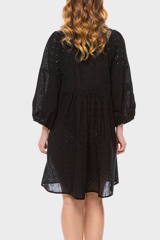 Effortlessly chic with a modern romantic twist, the ELLE Jane Dress in Black is your go-to for versatile elegance. Crafted from lightweight cotton with delicate eyelet embroidery, this mini dress features voluminous balloon sleeves, a flattering deep V-neckline, and a gently gathered waist for a floaty, feminine silhouette.

Whether you're dressing it up with heels for a night out or pairing it with espadrilles for a daytime stroll, the Jane Dress transitions seamlessly from season to season. It’s the little black dress—with a breezy, contemporary edge.

Key Features:

All-over eyelet embroidery

Lightweight and breathable fabric

Deep V-neckline

Long balloon sleeves with elastic cuffs

Above-the-knee hemline

Relaxed fit with a cinched waist

Main Fabric 100% Cotton

Embroidery 100% Polyester