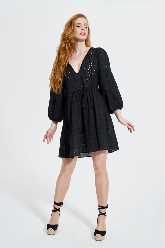 Effortlessly chic with a modern romantic twist, the ELLE Jane Dress in Black is your go-to for versatile elegance. Crafted from lightweight cotton with delicate eyelet embroidery, this mini dress features voluminous balloon sleeves, a flattering deep V-neckline, and a gently gathered waist for a floaty, feminine silhouette.

Whether you're dressing it up with heels for a night out or pairing it with espadrilles for a daytime stroll, the Jane Dress transitions seamlessly from season to season. It’s the little black dress—with a breezy, contemporary edge.

Key Features:

All-over eyelet embroidery

Lightweight and breathable fabric

Deep V-neckline

Long balloon sleeves with elastic cuffs

Above-the-knee hemline

Relaxed fit with a cinched waist

Main Fabric 100% Cotton

Embroidery 100% Polyester