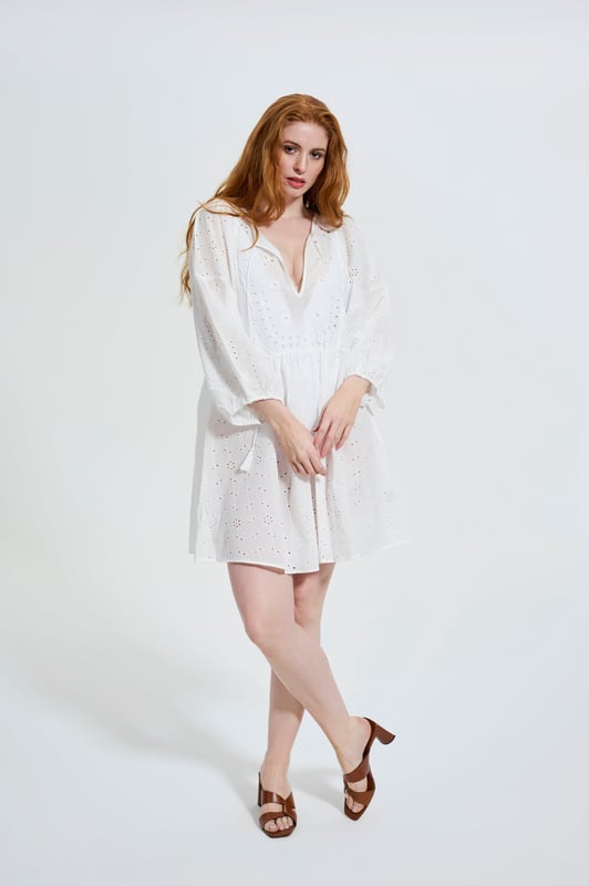 Effortlessly chic with a modern romantic twist, the ELLE Jane Dress in Black is your go-to for versatile elegance. Crafted from lightweight cotton with delicate eyelet embroidery, this mini dress features voluminous balloon sleeves, a flattering deep V-neckline, and a gently gathered waist for a floaty, feminine silhouette.

Whether you're dressing it up with heels for a night out or pairing it with espadrilles for a daytime stroll, the Jane Dress transitions seamlessly from season to season. It’s the little black dress—with a breezy, contemporary edge.

Key Features:

All-over eyelet embroidery

Lightweight and breathable fabric

Deep V-neckline

Long balloon sleeves with elastic cuffs

Above-the-knee hemline

Relaxed fit with a cinched waist

Main Fabric 100% Cotton

Embroidery 100% Polyester