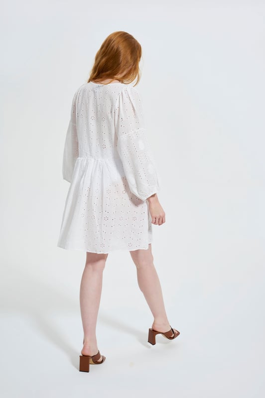 Effortlessly chic with a modern romantic twist, the ELLE Jane Dress in Black is your go-to for versatile elegance. Crafted from lightweight cotton with delicate eyelet embroidery, this mini dress features voluminous balloon sleeves, a flattering deep V-neckline, and a gently gathered waist for a floaty, feminine silhouette.

Whether you're dressing it up with heels for a night out or pairing it with espadrilles for a daytime stroll, the Jane Dress transitions seamlessly from season to season. It’s the little black dress—with a breezy, contemporary edge.

Key Features:

All-over eyelet embroidery

Lightweight and breathable fabric

Deep V-neckline

Long balloon sleeves with elastic cuffs

Above-the-knee hemline

Relaxed fit with a cinched waist

Main Fabric 100% Cotton

Embroidery 100% Polyester