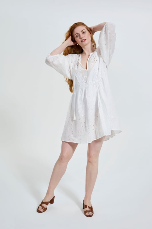 Effortlessly chic with a modern romantic twist, the ELLE Jane Dress in Black is your go-to for versatile elegance. Crafted from lightweight cotton with delicate eyelet embroidery, this mini dress features voluminous balloon sleeves, a flattering deep V-neckline, and a gently gathered waist for a floaty, feminine silhouette.

Whether you're dressing it up with heels for a night out or pairing it with espadrilles for a daytime stroll, the Jane Dress transitions seamlessly from season to season. It’s the little black dress—with a breezy, contemporary edge.

Key Features:

All-over eyelet embroidery

Lightweight and breathable fabric

Deep V-neckline

Long balloon sleeves with elastic cuffs

Above-the-knee hemline

Relaxed fit with a cinched waist

Main Fabric 100% Cotton

Embroidery 100% Polyester