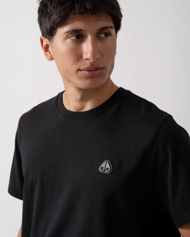 This t-shirt keeps it minimal with tiny branding at the front, offering a clean and understated look.


Regular Fit
Rib Knit Collar
Triangle Patch with Gun Metal Logo
Moose Knuckles Label on Side Seam



100% Pima Cotton Jersey
M15MT777