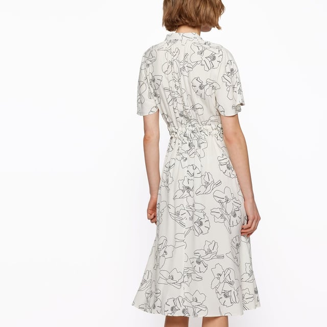 Women's Boss Dalluah Dress. A short-sleeved dress in a straight fit by BOSS Womenswear. Printed all over with a floral motif for modern impact, this elegant dress has a V neckline and a double belt for definition at the waist. Pairs well with low-heeled shoes and a classic jacket for a more understated look.- Regular fit with print.- Stand-up collar.- V-neck.- Small pleats along the shoulder line.- Short one-piece sleeves.- Matching belt that accentuates the waist. Material: 52% Viscose, 48% Cupro. Ref: 50472222962.