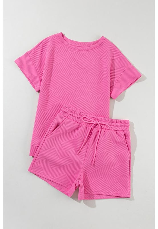 Our styles are designed with a trendy fitted look in mind following an international size standard. For the best fit we suggest choosing one size up from your usual. Be sure to check our sizing chart to find your perfect match!
  Two
  piece set suitable for warmer weather or casual occasions
  Made from a solid textured fabric
  Includes a short sleeve top and drawstring shorts in the same color
  Comfortable for activities such as lounging or running errands
Material: 95% Polyester 5% Elastane