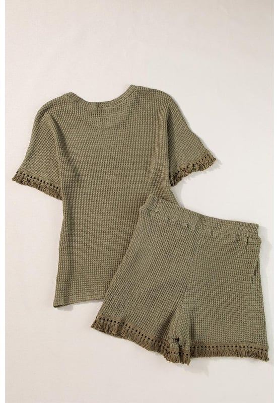 Our styles are designed with a trendy fitted look in mind following an international size standard. For the best fit we suggest choosing one size up from your usual. Be sure to check our sizing chart to find your perfect match!
  Laurel Green Fringe Trim Textured Short Two Piece Set
  Chic boho vibe with fringe trim
  Unique and fashionable textured fabric
  Includes a tee and shorts
  Stylish and comfortable
  Ideal for daily and casual occasions
Material: 67% Polyester 30% Viscose 3% Elastane