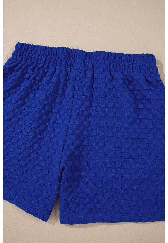 Our styles are designed with a trendy fitted look in mind following an international size standard. For the best fit we suggest choosing one size up from your usual. Be sure to check our sizing chart to find your perfect match!
  Jacquard textured fabric for a unique wear
  Loose fit tee with cuffed sleeves
  Decorative button details
  Matching shorts with elastic waist
  Side pockets for convenience
  Suitable for various occasions
Material: 95% Polyester 5% Elastane