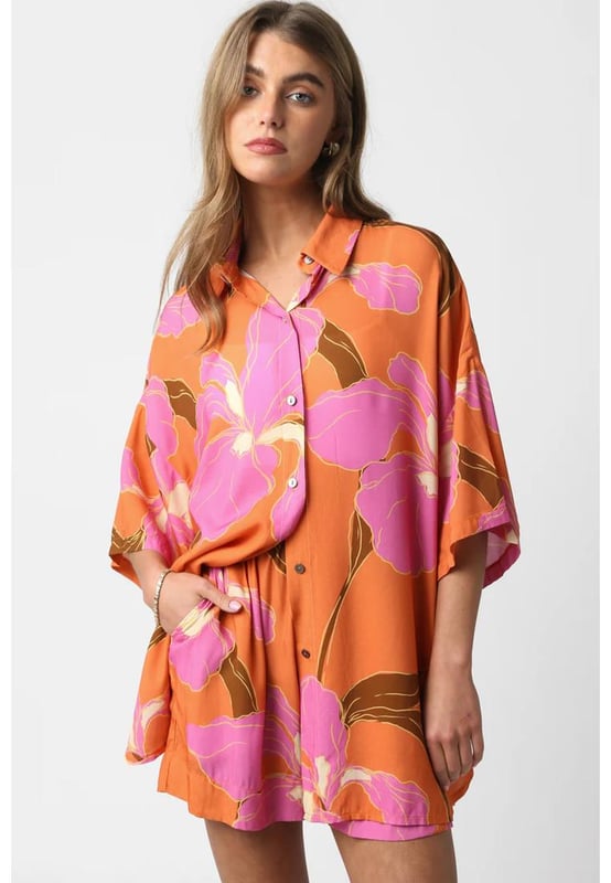 Our styles are designed with a trendy fitted look in mind following an international size standard. For the best fit we suggest choosing one size up from your usual. Be sure to check our sizing chart to find your perfect match!
  Tunic shirt and shorts set
  Russet orange floral print
  Collared neck
  Half sleeves
  Tunic length shirt
  Loose
  fitting matching shorts
  Relaxed fit shorts
  Elastic high waistline
Material: 100% Viscose
