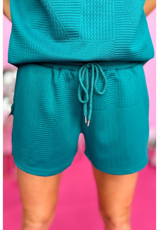 Our styles are designed with a trendy fitted look in mind following an international size standard. For the best fit we suggest choosing one size up from your usual. Be sure to check our sizing chart to find your perfect match!
  Two
  piece set includes a ruffled shoulder top and drawstring shorts
  Made from quilted fabric
  Sleeveless design
  Shorts with a drawstring waist
  Suitable for casual occasions
  Interchangeable pieces that can be worn with other wardrobe staples
Material: 95% Polyester 5% Elastane