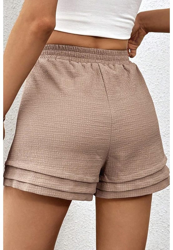 Fashionable tiered edge design
  High elastic waist for a flattering fit
  Textured fabric for a unique touch
  Versatile and suitable for various occasions
Material: 95% Polyester 5% Elastane