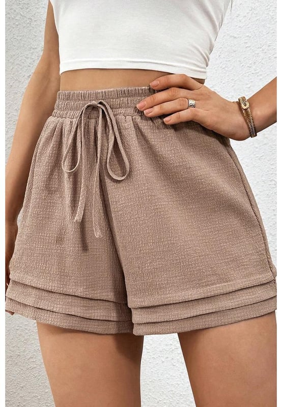 Fashionable tiered edge design
  High elastic waist for a flattering fit
  Textured fabric for a unique touch
  Versatile and suitable for various occasions
Material: 95% Polyester 5% Elastane