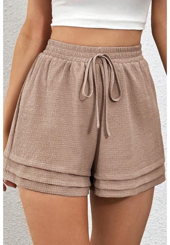 Fashionable tiered edge design
  High elastic waist for a flattering fit
  Textured fabric for a unique touch
  Versatile and suitable for various occasions
Material: 95% Polyester 5% Elastane