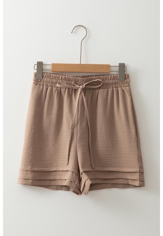 Fashionable tiered edge design
  High elastic waist for a flattering fit
  Textured fabric for a unique touch
  Versatile and suitable for various occasions
Material: 95% Polyester 5% Elastane