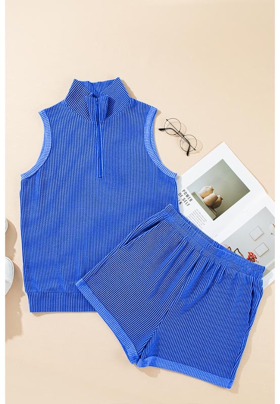 Two
  piece outfit
  High
  quality fabric with corded texture
  Collared tank top
  Matching pocketed shorts
  Half
  zipped high collar design
Material: 75% Polyester 20% Viscose 5% Elastane