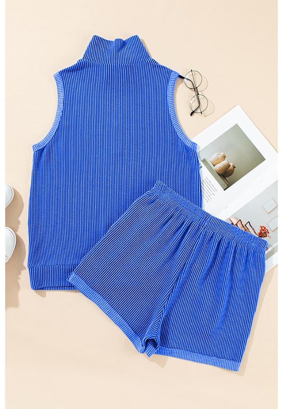 Two
  piece outfit
  High
  quality fabric with corded texture
  Collared tank top
  Matching pocketed shorts
  Half
  zipped high collar design
Material: 75% Polyester 20% Viscose 5% Elastane
