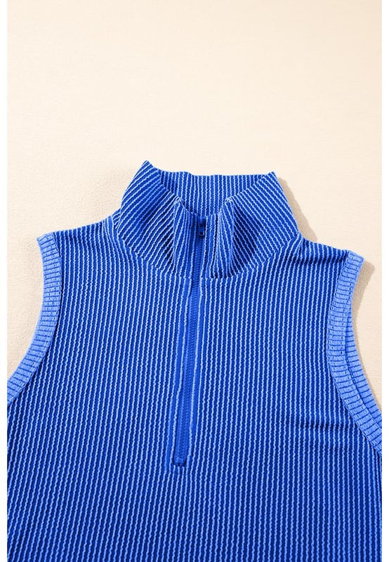 Two
  piece outfit
  High
  quality fabric with corded texture
  Collared tank top
  Matching pocketed shorts
  Half
  zipped high collar design
Material: 75% Polyester 20% Viscose 5% Elastane