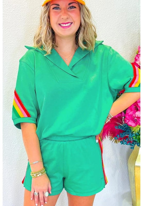Our styles are designed with a trendy fitted look in mind following an international size standard. For the best fit we suggest choosing one size up from your usual. Be sure to check our sizing chart to find your perfect match!
  Sea Green Rainbow Colorblock design for a lively and energetic vibe
  Collared top with a split neck for added sophistication
  Matching shorts included for a coordinated look
  Short sleeves for breathability and comfort in warmer weather
  Medium elasticity for a comfortable fit
Material: 80% Polyester 20% Cotton