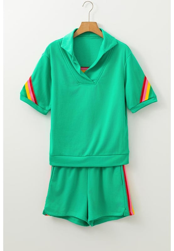 Our styles are designed with a trendy fitted look in mind following an international size standard. For the best fit we suggest choosing one size up from your usual. Be sure to check our sizing chart to find your perfect match!
  Sea Green Rainbow Colorblock design for a lively and energetic vibe
  Collared top with a split neck for added sophistication
  Matching shorts included for a coordinated look
  Short sleeves for breathability and comfort in warmer weather
  Medium elasticity for a comfortable fit
Material: 80% Polyester 20% Cotton
