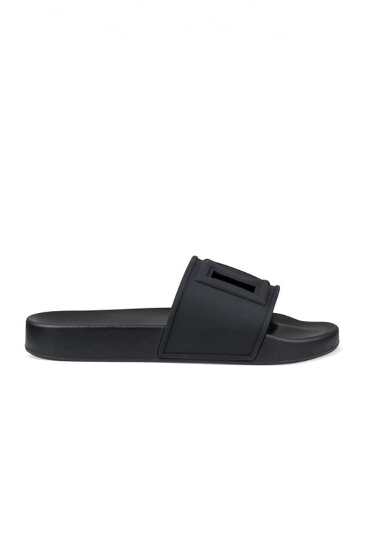 Dolce&Gabbana Slippers Zwart Dolce & Gabbana-slippers van zwart rubber.Logo in reliëf in het midden met openingen.Platte zool.Gemaakt in Italië.