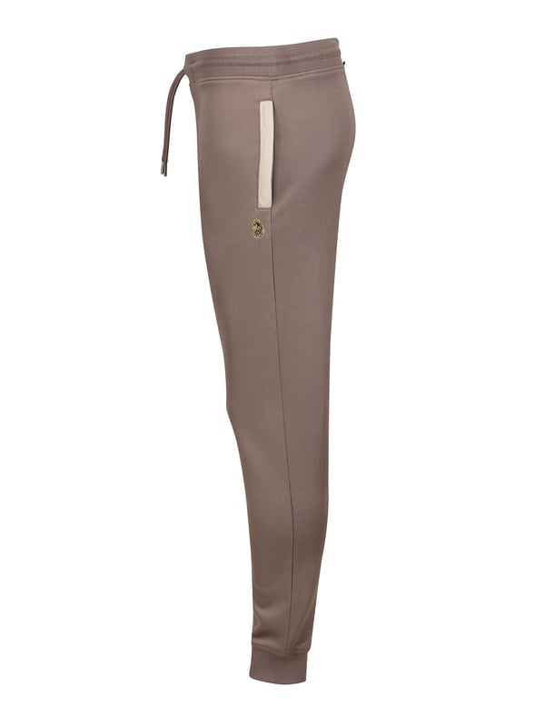 When it comes to sportswear staples, LUKE have you covered with these classic joggers. Crafted from a stretchy tricot with a comfy drawcord waistband, theyre ideal for everyday wear. They are detailed with contrast side welt pockets and are complete with the brands iconic lion head embroidery on the left leg.