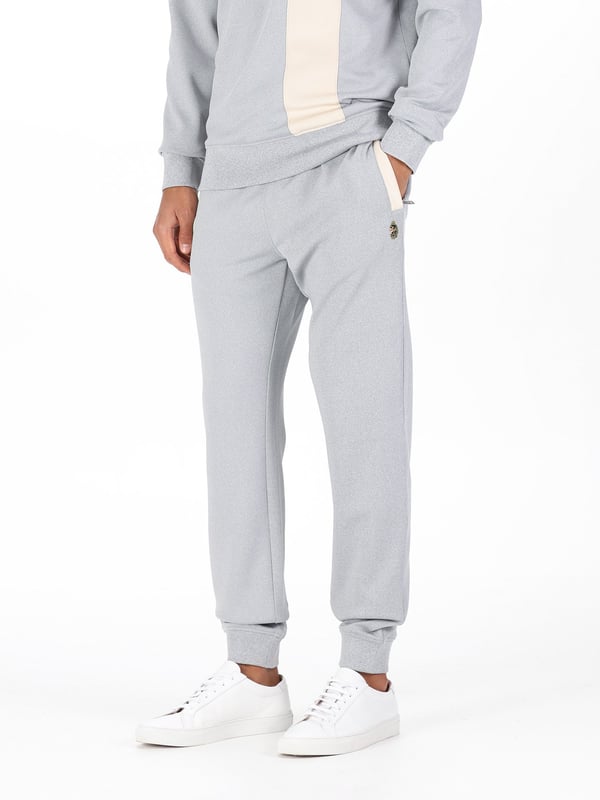 When it comes to sportswear staples, LUKE have you covered with these classic joggers. Crafted from a stretchy tricot with a comfy drawcord waistband, theyre ideal for everyday wear. They are detailed with contrast side welt pockets and are complete with the brands iconic lion head embroidery on the left leg.
