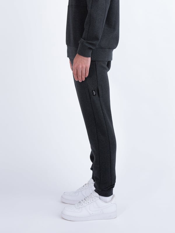 These premium joggers from LUKE are crafted from a smooth luxe touch fabrication, detailed with metal trims, and feature handy zip pockets, perfect for all your essentials. They are fitted with a comfy drawcord waistband for a customised fit and are detailed with a detachable striped tape on the left leg. The look is then signed off with the brands iconic shiny raised metal lion felt badge.