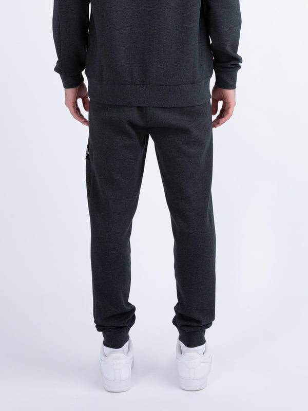 These premium joggers from LUKE are crafted from a smooth luxe touch fabrication, detailed with metal trims, and feature handy zip pockets, perfect for all your essentials. They are fitted with a comfy drawcord waistband for a customised fit and are detailed with a detachable striped tape on the left leg. The look is then signed off with the brands iconic shiny raised metal lion felt badge.