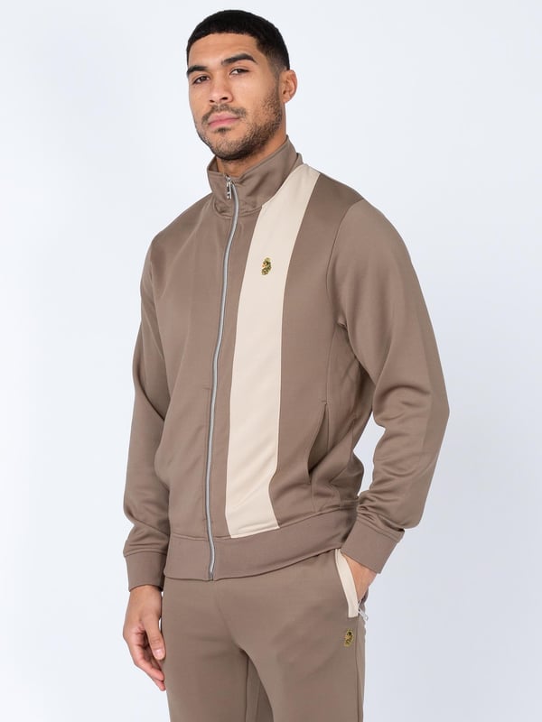 When it comes to sportswear staples, LUKE have you covered with this zip through sweat. Crafted from a stretchy tricot, it is detailed with a funnel neck and soft rib trims throughout. It features a cut and sew contrast vertical panel and is complete with the brands iconic lion head embroidery on the left chest.