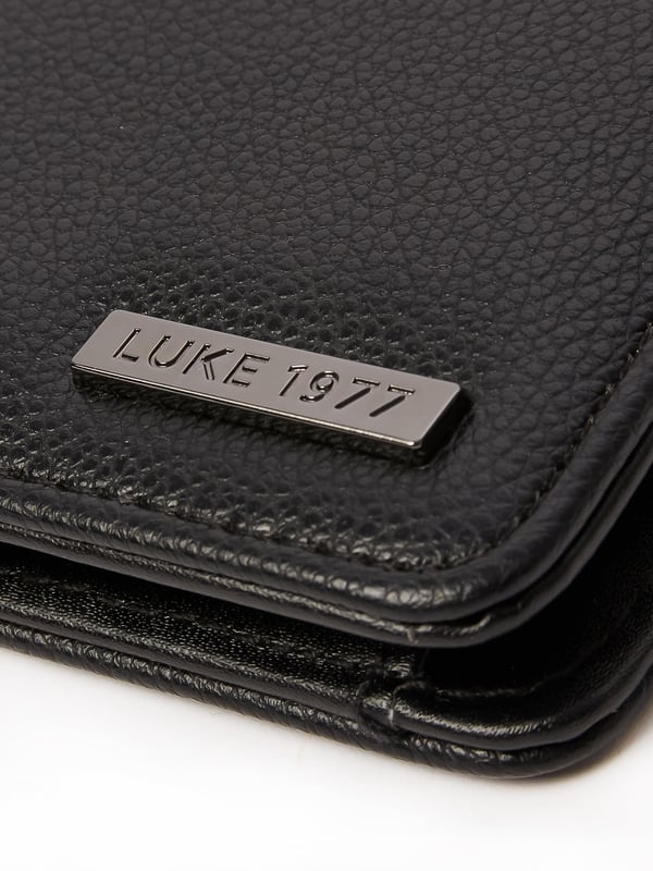 Elevate your accessory game with this stylish and essential set. The meticulously crafted ensemble includes a wallet and card holder and is the perfect addition to your collection. It could just as easily make a fantastic gift for those with style.