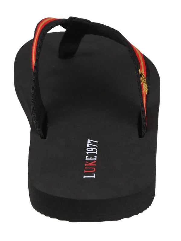 Elevate your down-time wardrobe with these LUKE canvas strap flip flops. They are detailed with the brand's iconic lion head embroidery and are stamped with the LUKE 1977 graphic on the sole.