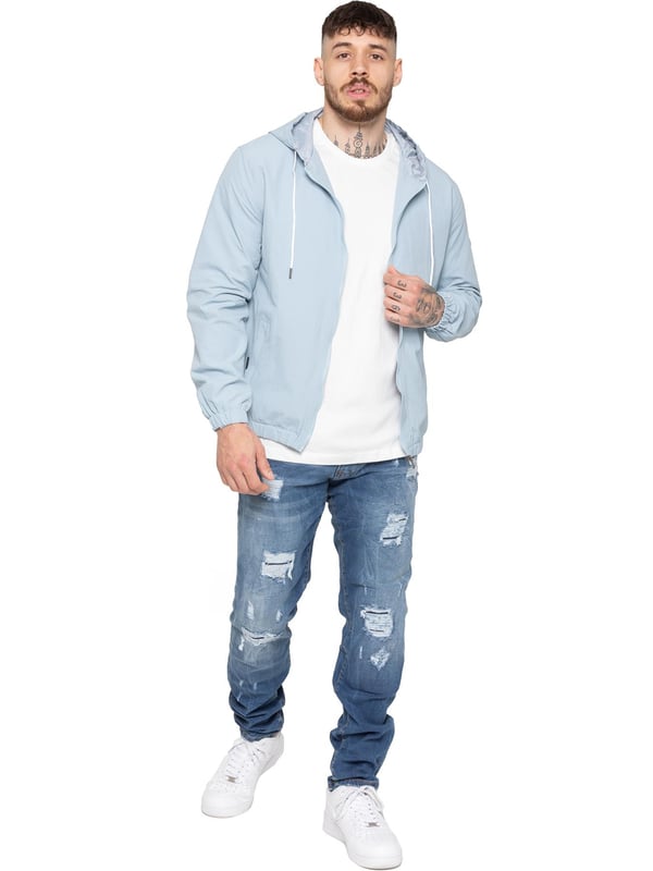 The Enzo Milano Men's Windbreaker Jacket offers a sleek, lightweight design with a regular fit. Made from durable tech fabric, it features a full zip, adjustable drawstring hood, and elasticated cuffs for added comfort and protection. With two concealed zip pockets, a single inner pocket, and an elasticated hem with a drawcord toggle, this water-Repellent jacket is perfect for everyday wear in light rain or windy conditions. Finished with the signature Enzo Milano rubber badge for a stylish touch.