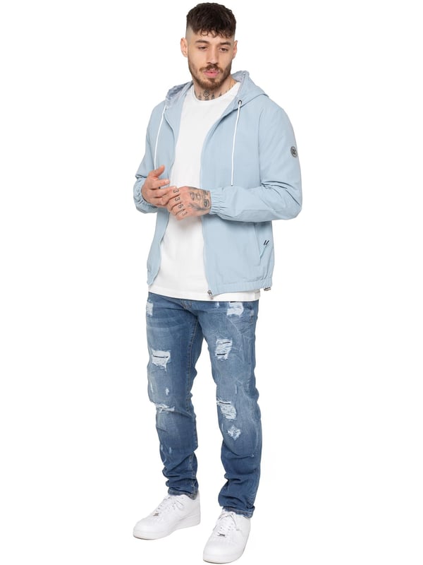 The Enzo Milano Men's Windbreaker Jacket offers a sleek, lightweight design with a regular fit. Made from durable tech fabric, it features a full zip, adjustable drawstring hood, and elasticated cuffs for added comfort and protection. With two concealed zip pockets, a single inner pocket, and an elasticated hem with a drawcord toggle, this water-Repellent jacket is perfect for everyday wear in light rain or windy conditions. Finished with the signature Enzo Milano rubber badge for a stylish touch.