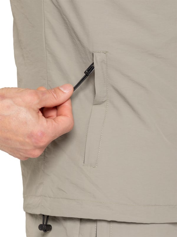 The Enzo Milano Men’s Lightweight Cargo Jacket is a sleek, functional outer layer made from water-repellent crushed poly fabric with a breathable mesh lining for all-day comfort. Designed in a regular fit, it features a full zip front, high neck, and adjustable drawcord hood for versatile coverage. With two Velcro chest pockets, two zippered side pockets, elasticated cuffs, and an adjustable drawcord hem, it offers both style and practicality—perfect for layering in changing weather.