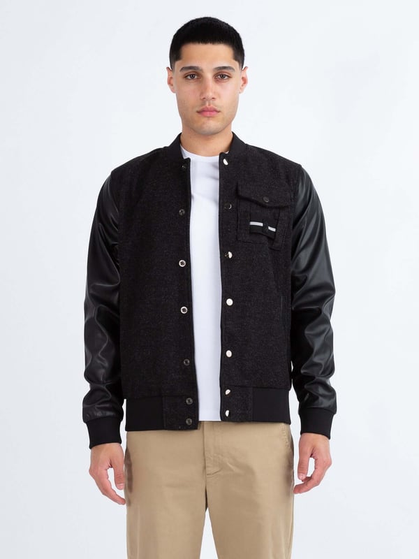 This premium varsity jacket from LUKE MAINLINE is your winter wardrobe staple. Constructed from our luxury Meltech fabrication, it is fully lined, and features contrast recycled PU sleeves. It is styled with shiny pewter snap buttons, soft rib trims throughout and a left chest pocket. This piece features a removable striped tape and is complete with the brands iconic raised metal felt badge.