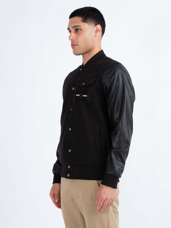 This premium varsity jacket from LUKE MAINLINE is your winter wardrobe staple. Constructed from our luxury Meltech fabrication, it is fully lined, and features contrast recycled PU sleeves. It is styled with shiny pewter snap buttons, soft rib trims throughout and a left chest pocket. This piece features a removable striped tape and is complete with the brands iconic raised metal felt badge.
