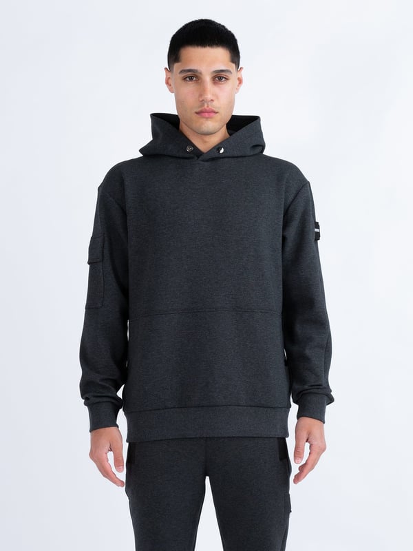 This premium hoodie from LUKE is crafted from a smooth luxe touch fabrication, cut to a relaxed fit and detailed with dark pewter gloss trims. It features a zip pocket on the right sleeve and handy lower front pockets. The hood is styled with a magnetic snap button at the front and the left sleeve is styled with a detachable striped tape detailed with the brands iconic shiny raised metal lion felt badge.