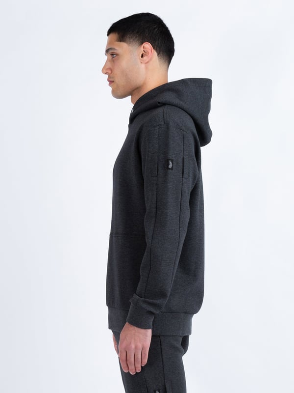 This premium hoodie from LUKE is crafted from a smooth luxe touch fabrication, cut to a relaxed fit and detailed with dark pewter gloss trims. It features a zip pocket on the right sleeve and handy lower front pockets. The hood is styled with a magnetic snap button at the front and the left sleeve is styled with a detachable striped tape detailed with the brands iconic shiny raised metal lion felt badge.