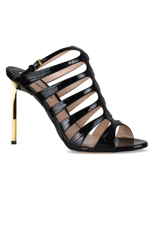 Sandalias de piel negra efecto cocodrilo de Tom Ford.Estilo de tiras. Hebilla en el tobillo.Acabados dorados.Tacón de espejo dorado.Puntera abierta redondeada.Altura del tacón 12 cm.Made in Italy.