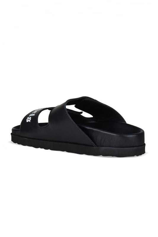 Sandalias Palm Angels de piel negra.Tiras de piel negra con logotipo blanco.Cierre de velcro.Suela plana de goma.Made in Italy.