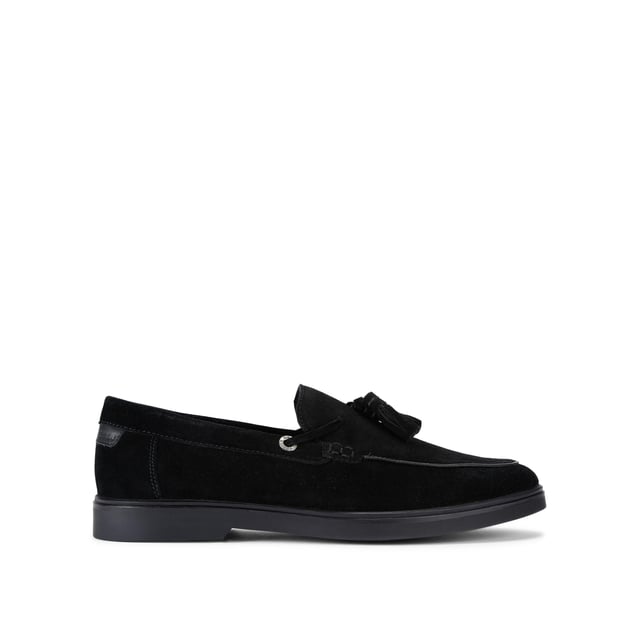 The KG Kurt Geiger Ronan is a slip-on shoe crafted from a black suede leather. There are antiqued brass branded eyelets on each side with a tassel detail on the toe.
