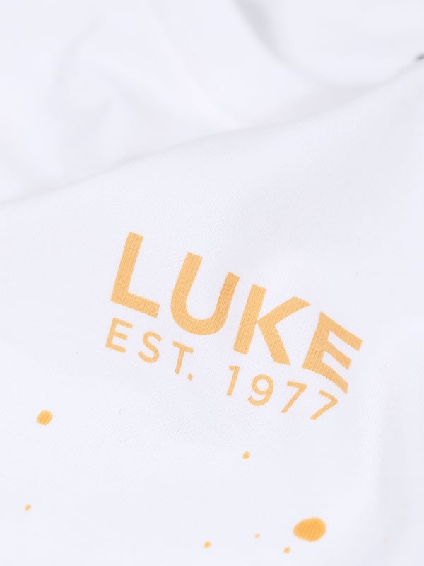 This stylish, paint splatter tee from LUKE is sure to be your go to this season. Cut to a relaxed fit, it is styled with a soft rib crew neck for all day comfort and features a LUKE EST. 1977 text print at the centre of the chest.