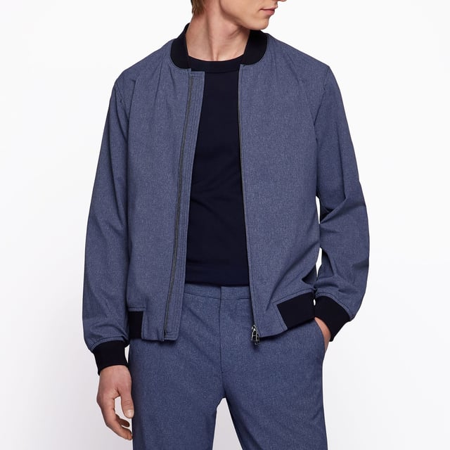 Men's Boss P-Hanry Bomber Jacket. BI-Stretch Performance bomber jacket. This model is made of high-quality stretch mesh fabric for optimal freedom of movement. The jacket is equipped with a mao collar and elastic knitted cuffs. Create a variety of looks with this modern model.- Knit cuffs and collar.- Front closure with zipper.- Performance attributes lined with meshlining.- Performance contrast details. Material: 100% Polyester. Ref: 50468913494.